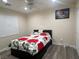 Bedroom featuring ceiling fan, plantation shutters, and laminate floors at 10618 Timber Stand St, Las Vegas, NV 89183