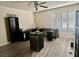 Bonus room with desks, mini fridge, wood floors, and plantation shutters at 10618 Timber Stand St, Las Vegas, NV 89183