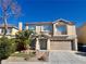 Charming two-story home featuring a well-maintained yard and a two-car garage at 10618 Timber Stand St, Las Vegas, NV 89183