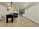 Inviting living room with wood floors, recessed lighting, and foosball table at 10618 Timber Stand St, Las Vegas, NV 89183