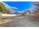 Backyard view highlighting the home's structure and ample outdoor space surrounded by fencing at 1106 Emerald Stone Ave, North Las Vegas, NV 89081