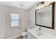 Bathroom featuring a tub, window, and modern vanity with a sink at 1106 Emerald Stone Ave, North Las Vegas, NV 89081