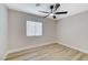 Bright bedroom with wood-look flooring, window and modern ceiling fan at 1106 Emerald Stone Ave, North Las Vegas, NV 89081