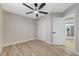 Bedroom with ceiling fan, closet, wood-look floors and neutral decor at 1106 Emerald Stone Ave, North Las Vegas, NV 89081