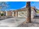 A single-story home features a two-car garage, low maintenance yard, and tile roof at 1106 Emerald Stone Ave, North Las Vegas, NV 89081