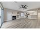 Living area featuring a fireplace, open layout, and view to the updated kitchen at 1106 Emerald Stone Ave, North Las Vegas, NV 89081