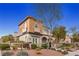 Two-story home with balcony, landscaping, and stone accents at 11262 Corsica Mist Ave, Las Vegas, NV 89135