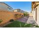 Enclosed backyard offers a private outdoor space with brick pavers and low-maintenance landscaping at 1209 Crystal Grotto Ave, North Las Vegas, NV 89081