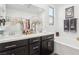 Elegant bathroom featuring a double vanity, soaking tub, and stylish decor at 1209 Crystal Grotto Ave, North Las Vegas, NV 89081