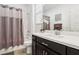 Cozy bathroom featuring a shower with tub and large mirror at 1209 Crystal Grotto Ave, North Las Vegas, NV 89081