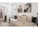 Bedroom featuring a stylish daybed and view of the ensuite bathroom at 1209 Crystal Grotto Ave, North Las Vegas, NV 89081