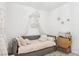 Bedroom featuring a stylish daybed with sheer curtains and star decor at 1209 Crystal Grotto Ave, North Las Vegas, NV 89081