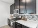 Contemporary kitchen featuring stainless steel appliances and quartz countertops at 1209 Crystal Grotto Ave, North Las Vegas, NV 89081