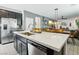 Modern kitchen with stainless appliances, quartz counters, and an open floor plan at 1209 Crystal Grotto Ave, North Las Vegas, NV 89081