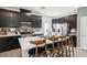 Stylish kitchen featuring dark cabinetry, a large center island, and stainless steel appliances at 1209 Crystal Grotto Ave, North Las Vegas, NV 89081