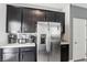 Contemporary kitchen with stainless steel refrigerator and ample counter space at 1209 Crystal Grotto Ave, North Las Vegas, NV 89081