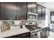 Modern kitchen featuring a gas range, stainless steel appliances, and ample cabinet space at 1209 Crystal Grotto Ave, North Las Vegas, NV 89081