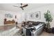 Bright living room with a leather couch, wood floors, and decorative elements at 1209 Crystal Grotto Ave, North Las Vegas, NV 89081