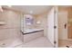 Modern bathroom featuring a soaking tub and a separate glass-enclosed shower for a luxurious experience at 135 E Harmon Ave # 817, Las Vegas, NV 89109