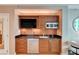 The kitchenette is equipped with wooden cabinets and a countertop at 135 E Harmon Ave # 817, Las Vegas, NV 89109