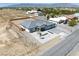 Aerial view of a modern home with a gray roof and a spacious, fenced backyard at 1691 Blackhorn St, Pahrump, NV 89048