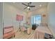 Cozy bedroom featuring a pink chair and accent decor with a comfortable-looking bed at 1691 Blackhorn St, Pahrump, NV 89048