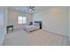 Spacious bedroom with soft neutral carpet, a minimalist aesthetic and natural light from a large window at 1691 Blackhorn St, Pahrump, NV 89048