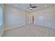 Open bedroom layout with carpeted floors, a ceiling fan, and an open view into the home's hallway at 1691 Blackhorn St, Pahrump, NV 89048