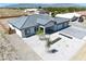 An aerial view of the house featuring a xeriscaped yard, and large paver driveway at 1691 Blackhorn St, Pahrump, NV 89048