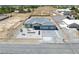 Aerial view of a home featuring an oversized lot, xeriscaped yard, and large paver driveway at 1691 Blackhorn St, Pahrump, NV 89048