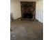 Living room with a large stone fireplace and hearth, with a dirty floor at 1836 Mcdaniel St, North Las Vegas, NV 89030