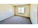 Clean bedroom showcasing a view from the window and neutral carpet at 1838 Fighting Falcon Ln, North Las Vegas, NV 89031