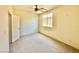 Cozy bedroom featuring carpet flooring and natural light at 1838 Fighting Falcon Ln, North Las Vegas, NV 89031