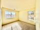 Neutral bedroom featuring two windows overlooking the neighborhood at 1838 Fighting Falcon Ln, North Las Vegas, NV 89031