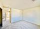 Bedroom area with carpet, light walls, and an entry doorway at 1838 Fighting Falcon Ln, North Las Vegas, NV 89031