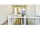 Spacious hallway at the top of the stairs with natural light and neutral paint at 1838 Fighting Falcon Ln, North Las Vegas, NV 89031