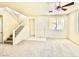 Well-lit living area with stairs and a tiled entrance area at 1838 Fighting Falcon Ln, North Las Vegas, NV 89031