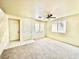 Cozy living area showcasing carpet flooring, natural light, and a seamless flow to other spaces at 1838 Fighting Falcon Ln, North Las Vegas, NV 89031