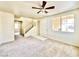 Bright living room with neutral carpet, staircase, and a well-lit interior at 1838 Fighting Falcon Ln, North Las Vegas, NV 89031