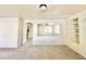 Carpeted living room with views to the hallway and front door at 1838 Fighting Falcon Ln, North Las Vegas, NV 89031