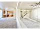 Bright living space with a view of the kitchen, stairs, and neutral carpet at 1838 Fighting Falcon Ln, North Las Vegas, NV 89031