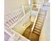 Carpeted staircase with white railing provides access to the home's lower level at 1838 Fighting Falcon Ln, North Las Vegas, NV 89031