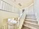 Carpeted staircase with white railing provides access to the home's upper level at 1838 Fighting Falcon Ln, North Las Vegas, NV 89031