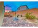 Brick paved backyard with a hammock and string lights at 200 Denette Ln, North Las Vegas, NV 89031