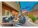 Evening view of backyard patio with seating area and string lights at 200 Denette Ln, North Las Vegas, NV 89031