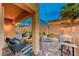 Cozy backyard patio with seating area and outdoor grill at 200 Denette Ln, North Las Vegas, NV 89031