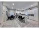 Modern kitchen boasts white cabinets, granite counters, stainless steel appliances, and an island at 200 Denette Ln, North Las Vegas, NV 89031