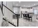 Modern staircase with dark wood and white railings offering a view of the main level at 200 Denette Ln, North Las Vegas, NV 89031