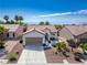 Single-story home with attached garage and desert landscaping at 2127 Sawtooth Mountain Dr, Henderson, NV 89044