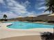 Inviting resort-style pool with ample lounge chairs and umbrellas at 2127 Sawtooth Mountain Dr, Henderson, NV 89044